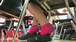 Girl Playing with her Shoes in Class