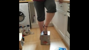 Crushing the Recycling in Purple High Heels