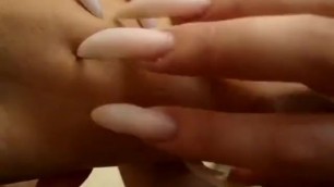 Long Nails Scratching Arm