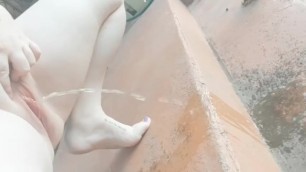 Naughty Aussie Slut Takes a Quick Piss in her Backyard