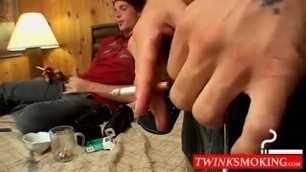 Buddies really love to smoke and stroke cocks in the bedroom